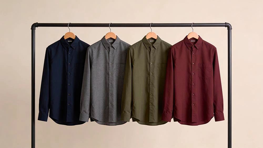 Camera-Friendly Shirt Colors best colors to wear on video calls shirts in navy charcoal olive and burgundy hanging neatly