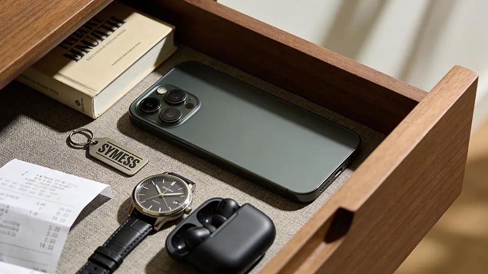 Dating app burnout for men reset with phone in drawer beside a book and gym key